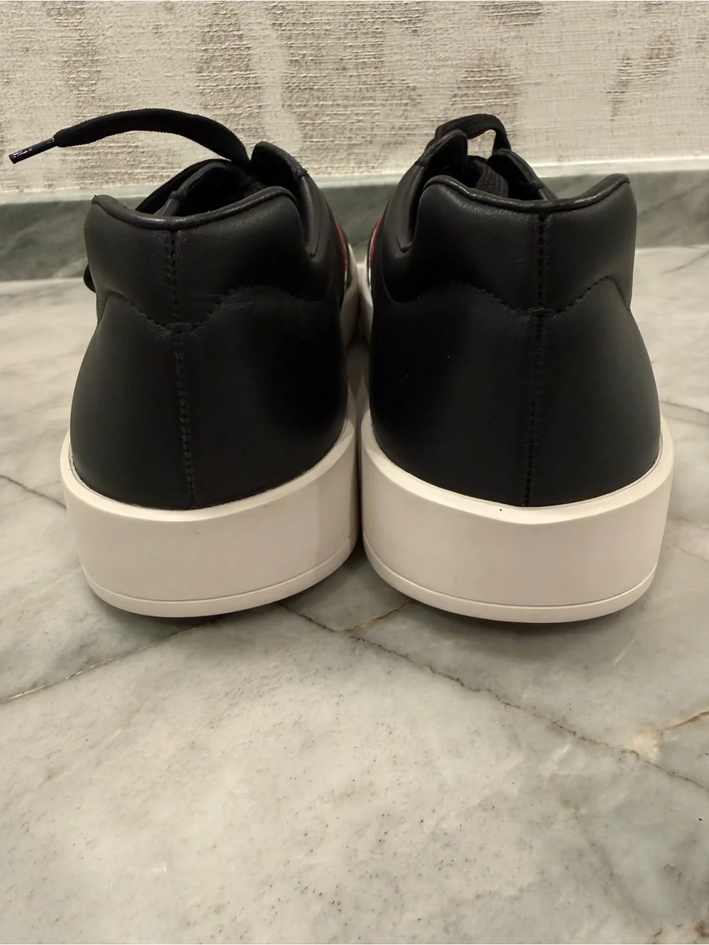 Prada Black Leather Sneakers with Red Stripe and White Sole